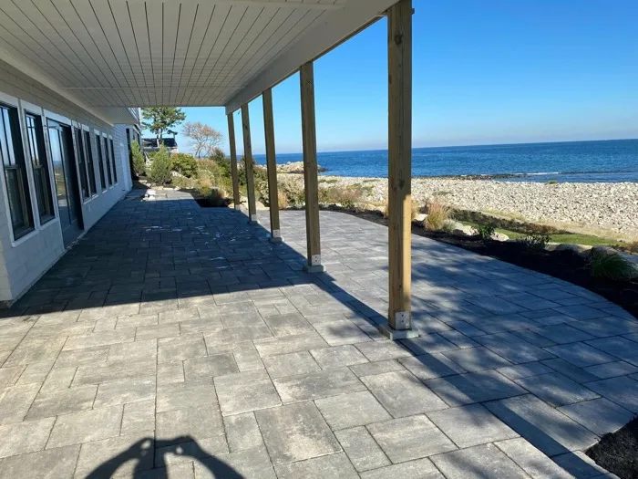 Flagstone patio with fire pit seating area