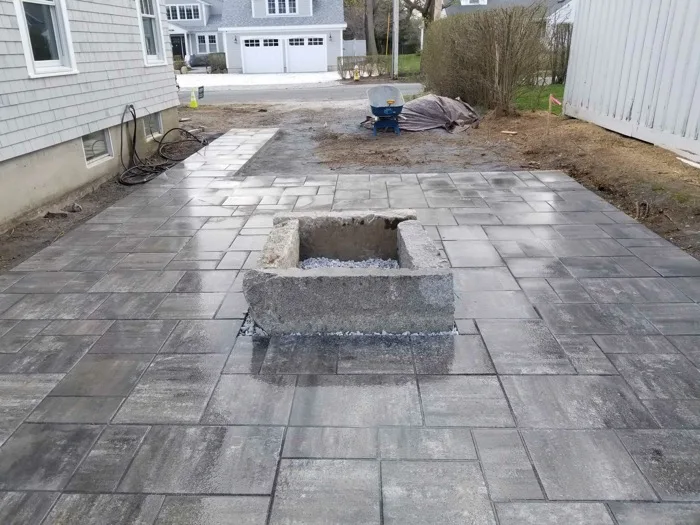 Stamped concrete patio with landscaping
