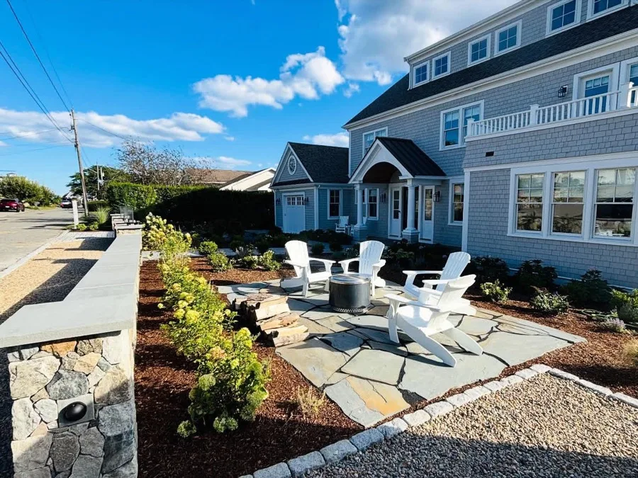 Custom stone fire pit patio and paver walkway estate entrance