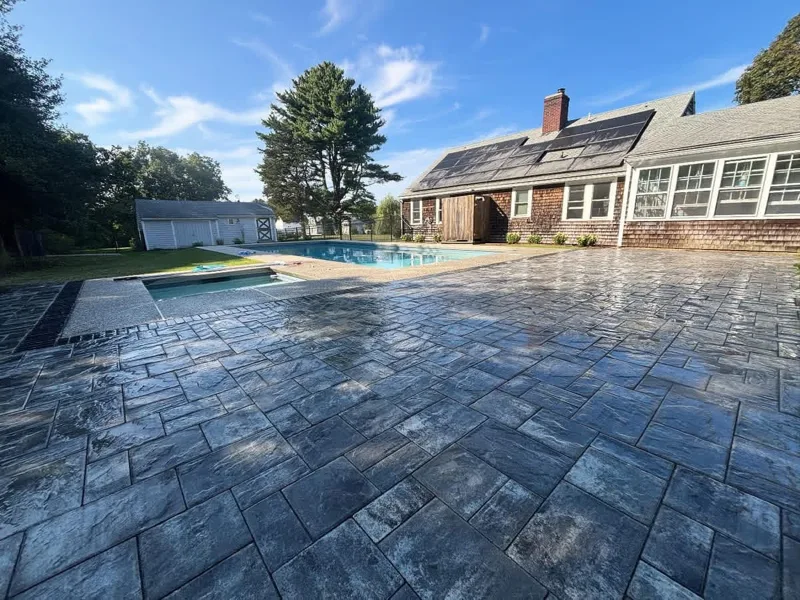 Stamped concrete patio and hardscape installation on the South Shore